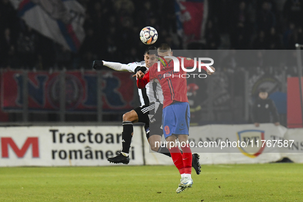 Daniel Birligea and Lucas Gabriel MASOERO are in action during the Superliga match between Universitatea Cluj and FCSB at Cluj Arena in Cluj...