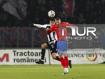 Daniel Birligea and Lucas Gabriel MASOERO are in action during the Superliga match between Universitatea Cluj and FCSB at Cluj Arena in Cluj...