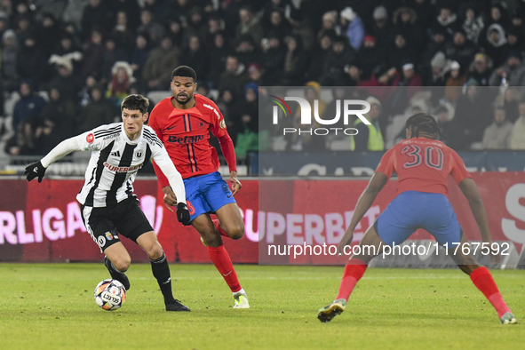 Vladislav Blanuta and Malcom Sylas Laouari EDJOUMA are in action during the Superliga match between Universitatea Cluj and FCSB at Cluj Aren...