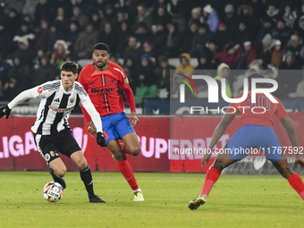 Vladislav Blanuta and Malcom Sylas Laouari EDJOUMA are in action during the Superliga match between Universitatea Cluj and FCSB at Cluj Aren...