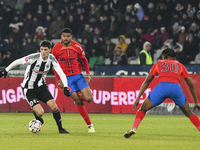 Vladislav Blanuta and Malcom Sylas Laouari EDJOUMA are in action during the Superliga match between Universitatea Cluj and FCSB at Cluj Aren...