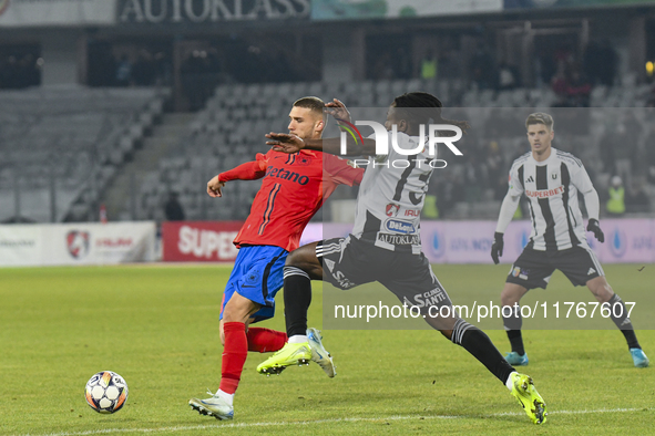 Daniel Birligea and Franck TCHASSEM are in action during the Superliga match between Universitatea Cluj and FCSB at Cluj Arena in Cluj, Roma...