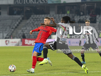 Daniel Birligea and Franck TCHASSEM are in action during the Superliga match between Universitatea Cluj and FCSB at Cluj Arena in Cluj, Roma...