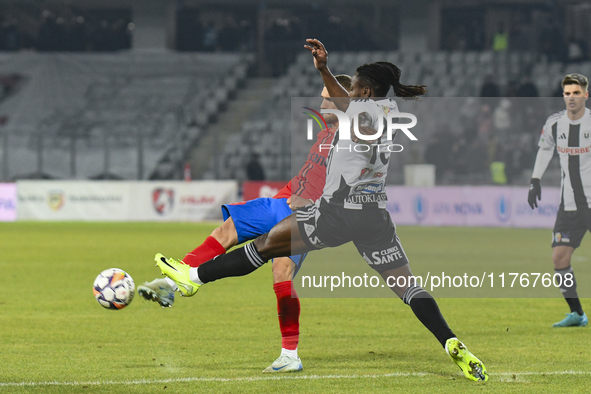 Daniel Birligea and Franck TCHASSEM are in action during the Superliga match between Universitatea Cluj and FCSB at Cluj Arena in Cluj, Roma...