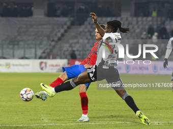 Daniel Birligea and Franck TCHASSEM are in action during the Superliga match between Universitatea Cluj and FCSB at Cluj Arena in Cluj, Roma...