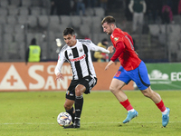 Lucas Gabriel Masoero and Daniel Popa are in action during the Superliga match between Universitatea Cluj and FCSB at Cluj Arena in Cluj, Ro...