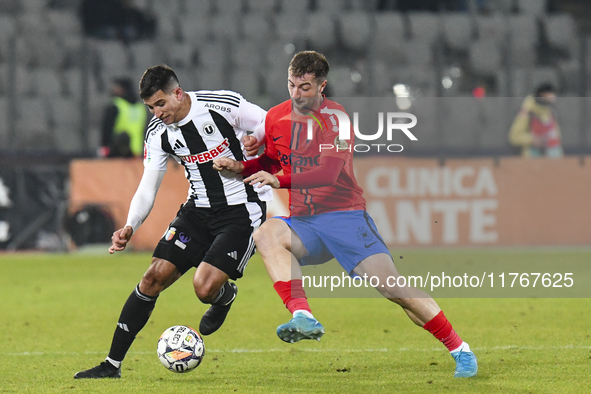 Lucas Gabriel Masoero and Daniel Popa are in action during the Superliga match between Universitatea Cluj and FCSB at Cluj Arena in Cluj, Ro...