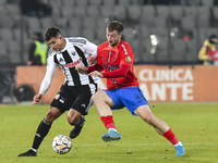 Lucas Gabriel Masoero and Daniel Popa are in action during the Superliga match between Universitatea Cluj and FCSB at Cluj Arena in Cluj, Ro...