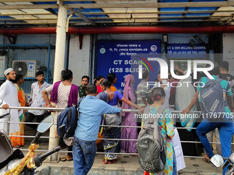 People stand outside a billing counter inside a government-run hospital in Kolkata, India, on November 11, 2024. (