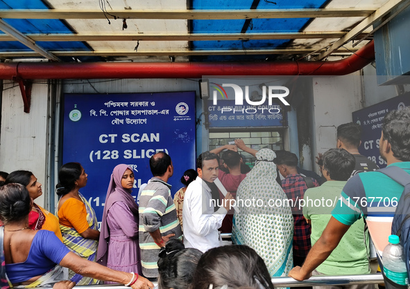 People stand outside a billing counter inside a government-run hospital in Kolkata, India, on November 11, 2024. 