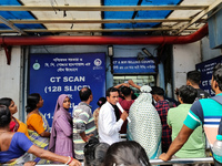 People stand outside a billing counter inside a government-run hospital in Kolkata, India, on November 11, 2024. (