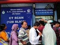 People stand outside a billing counter inside a government-run hospital in Kolkata, India, on November 11, 2024. (