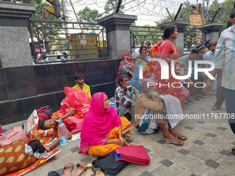 Patient relatives sit inside a government-run hospital in Kolkata, India, on November 11, 2024. (