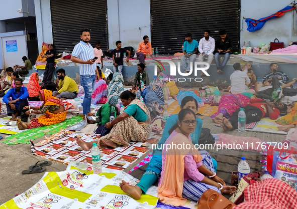 Patient relatives sit inside a government-run hospital in Kolkata, India, on November 11, 2024. 