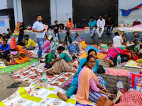 Patient relatives sit inside a government-run hospital in Kolkata, India, on November 11, 2024. (