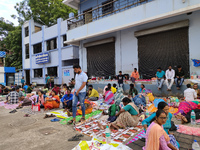 Patient relatives sit inside a government-run hospital in Kolkata, India, on November 11, 2024. (