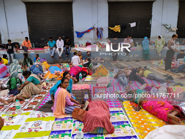 Patient relatives sit inside a government-run hospital in Kolkata, India, on November 11, 2024. 