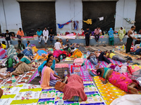 Patient relatives sit inside a government-run hospital in Kolkata, India, on November 11, 2024. (