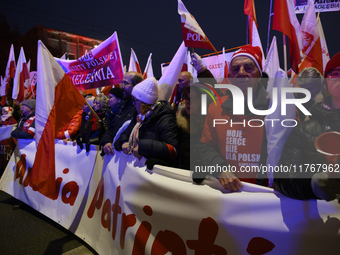 People take part in the 106th anniversary of Poland regaining its independence in Warsaw, Poland, on November 11, 2023. Thousands of people...