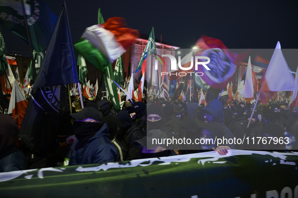 Members of Italian and Polish far-right groups wave flags as they participate in the 106th anniversary of Poland regaining its independence...