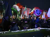 Members of Italian and Polish far-right groups wave flags as they participate in the 106th anniversary of Poland regaining its independence...