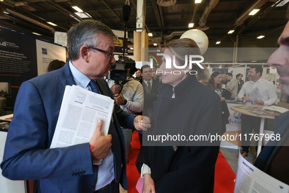 French Minister of Labor and Employment Astrid Panosyan-Bouvet (R) speaks with former French centrist UDI Member of Parliament Yves Jego (L)...