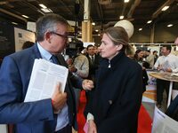 French Minister of Labor and Employment Astrid Panosyan-Bouvet (R) speaks with former French centrist UDI Member of Parliament Yves Jego (L)...