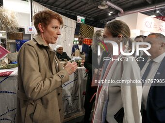 French Minister of Labor and Employment Astrid Panosyan-Bouvet (R) speaks with French journalist Natacha Polony (L) as she visits the ''Made...