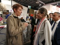 French Minister of Labor and Employment Astrid Panosyan-Bouvet (R) speaks with French journalist Natacha Polony (L) as she visits the ''Made...