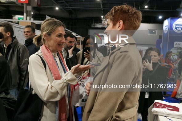 French Minister of Labor and Employment Astrid Panosyan-Bouvet (R) speaks with French journalist Natacha Polony (L) as she visits the ''Made...