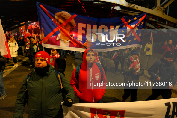 Paricitpants carry an anti-EU banner featuring an effigy of European Commission President Ursula Von Der Leyen in Warsaw, Poland on 11 Novem...