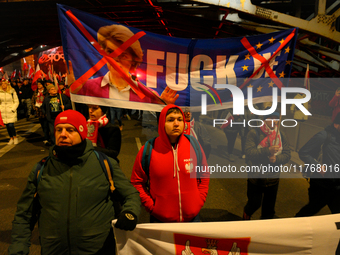 Paricitpants carry an anti-EU banner featuring an effigy of European Commission President Ursula Von Der Leyen in Warsaw, Poland on 11 Novem...