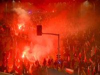 People take part in marking the 106th independence celebration in Warsaw, Poland on 11 November, 2024. A march organized by far-right, natio...