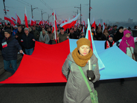 Pariticpants hold a Polish flag in Warsaw, Poland on 11 November, 2024. A march organized by far-right, nationalist organizations was allowe...