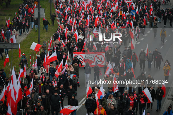 People take part in marking the 106th independence celebration in Warsaw, Poland on 11 November, 2024. A march organized by far-right, natio...