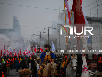 People take part in marking the 106th independence celebration in Warsaw, Poland on 11 November, 2024. A march organized by far-right, natio...