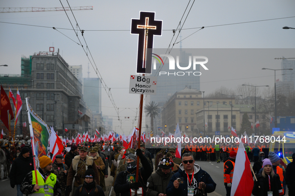 A man olds a cross during the Independence Day march in Warsaw, Poland on 11 November, 2024. A march organized by far-right, nationalist org...