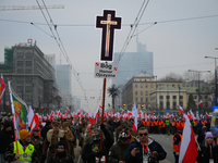 A man olds a cross during the Independence Day march in Warsaw, Poland on 11 November, 2024. A march organized by far-right, nationalist org...