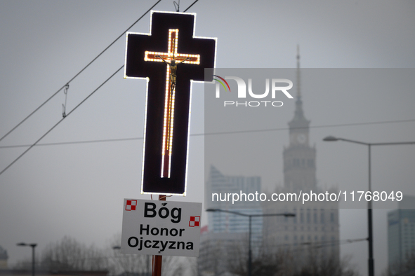 A cross is seen during the Independence Day march in Warsaw, Poland on 11 November, 2024. A march organized by far-right, nationalist organi...