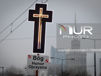 A cross is seen during the Independence Day march in Warsaw, Poland on 11 November, 2024. A march organized by far-right, nationalist organi...