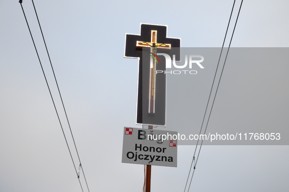 A cross is seen during the Independence Day march in Warsaw, Poland on 11 November, 2024. A march organized by far-right, nationalist organi...