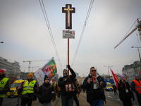 A man olds a cross during the Independence Day march in Warsaw, Poland on 11 November, 2024. A march organized by far-right, nationalist org...