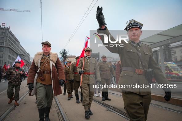 Participants dressed as soldiers are seen during the Independence Day march in Warsaw, Poland on 11 November, 2024. A march organized by far...