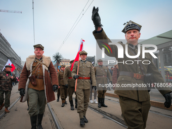 Participants dressed as soldiers are seen during the Independence Day march in Warsaw, Poland on 11 November, 2024. A march organized by far...