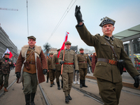 Participants dressed as soldiers are seen during the Independence Day march in Warsaw, Poland on 11 November, 2024. A march organized by far...