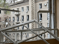 A building with smashed windows is visible from a gym in the sports complex of the Zaporizhzhia Polytechnic National University, which is da...