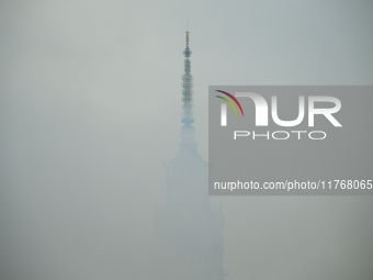 The Palace of Culture is seen behing a wall of smoke for flares in Warsaw, Poland on 11 November, 2024. A march organized by far-right, nati...