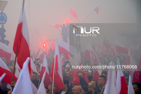 People take part in marking the 106th independence celebration in Warsaw, Poland on 11 November, 2024. A march organized by far-right, natio...