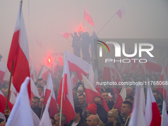 People take part in marking the 106th independence celebration in Warsaw, Poland on 11 November, 2024. A march organized by far-right, natio...