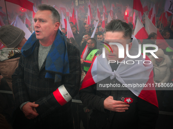 People take part in marking the 106th independence celebration in Warsaw, Poland on 11 November, 2024. A march organized by far-right, natio...